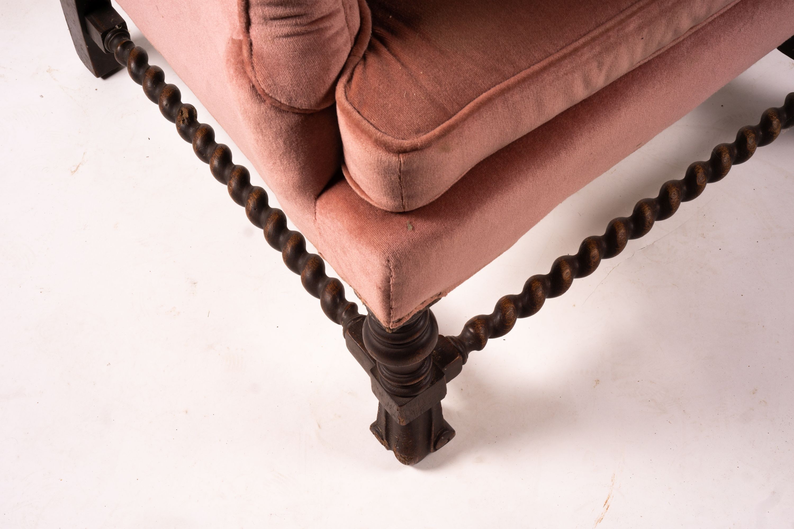 An early 20th century Jacobean revival upholstered wing armchair, width 84cm, depth 90cm, height 128cm